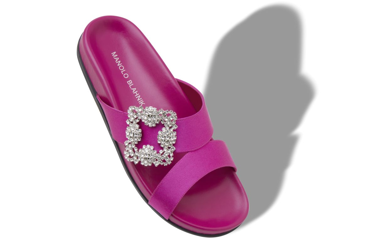 Celeste Halo Pink Jewel Buckle Mules – front three-quarter view showing pink jewel buckle, crossover, open toe, satin…