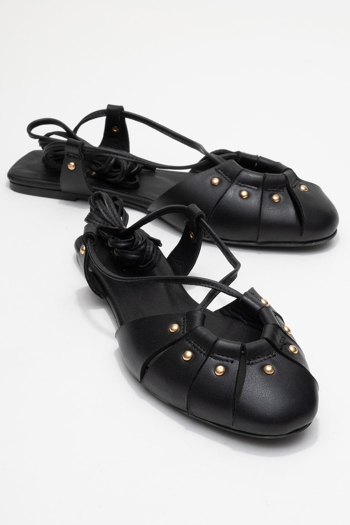 Daria - Black Genuine Leather Studded Ankle-Lace Sandal – front three-quarter view showing lace, leather, metallic…