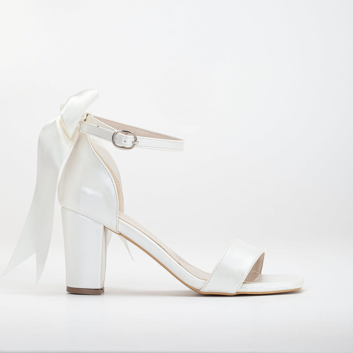 Noelle - Ivory Wedding Sandals with Ribbon – front three-quarter view showing leather, ivory, SimmiUnique