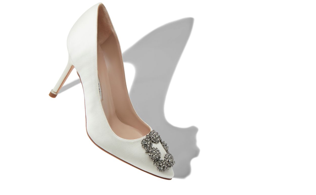 Bianca Élan White Jewel Buckle Pumps – front three-quarter view showing white jewel buckle, crystal buckle, almond toe…