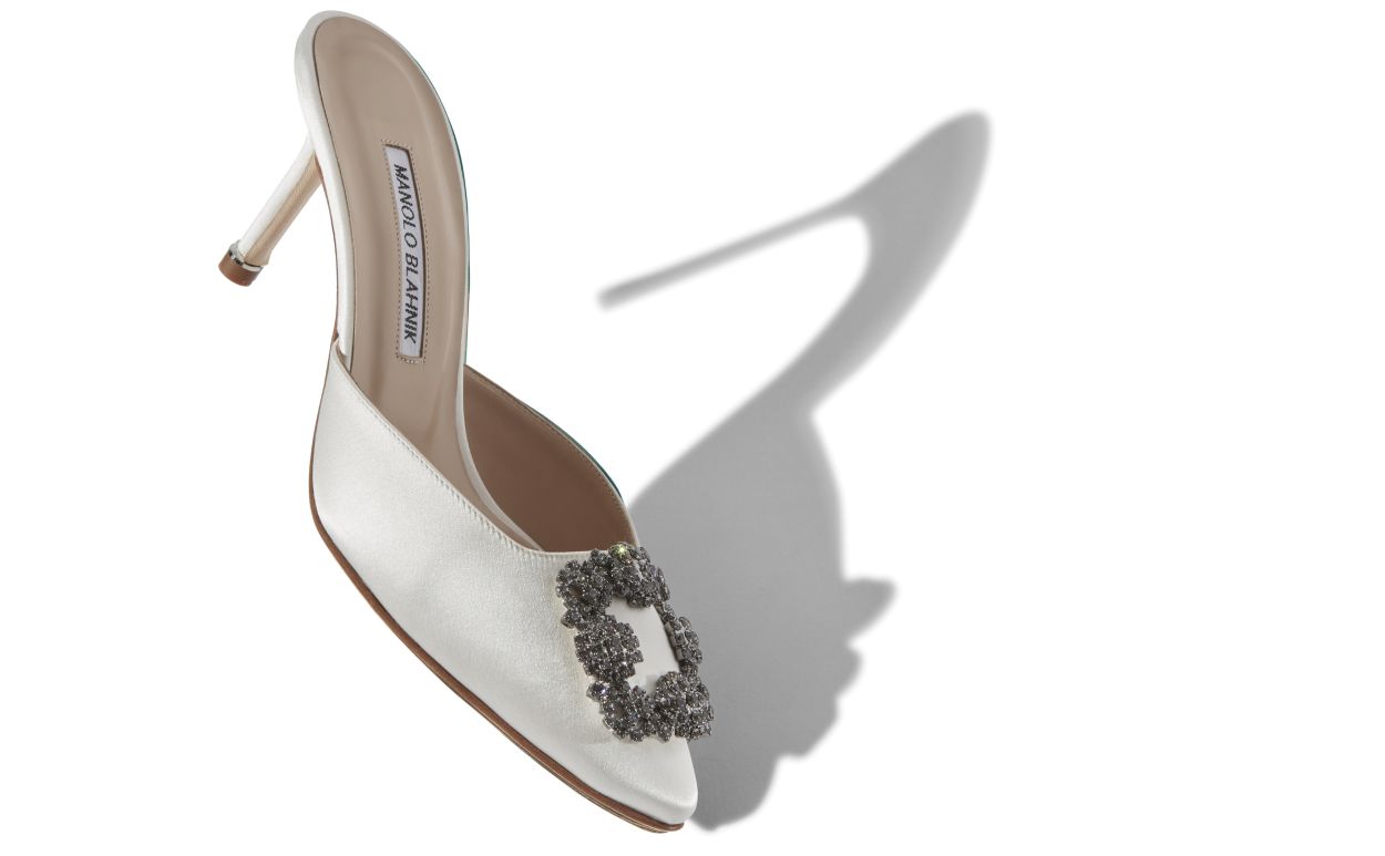 Noelle Dawn White Jewel Buckle Mules – front three-quarter view showing white jewel buckle, crystal buckle, almond toe…