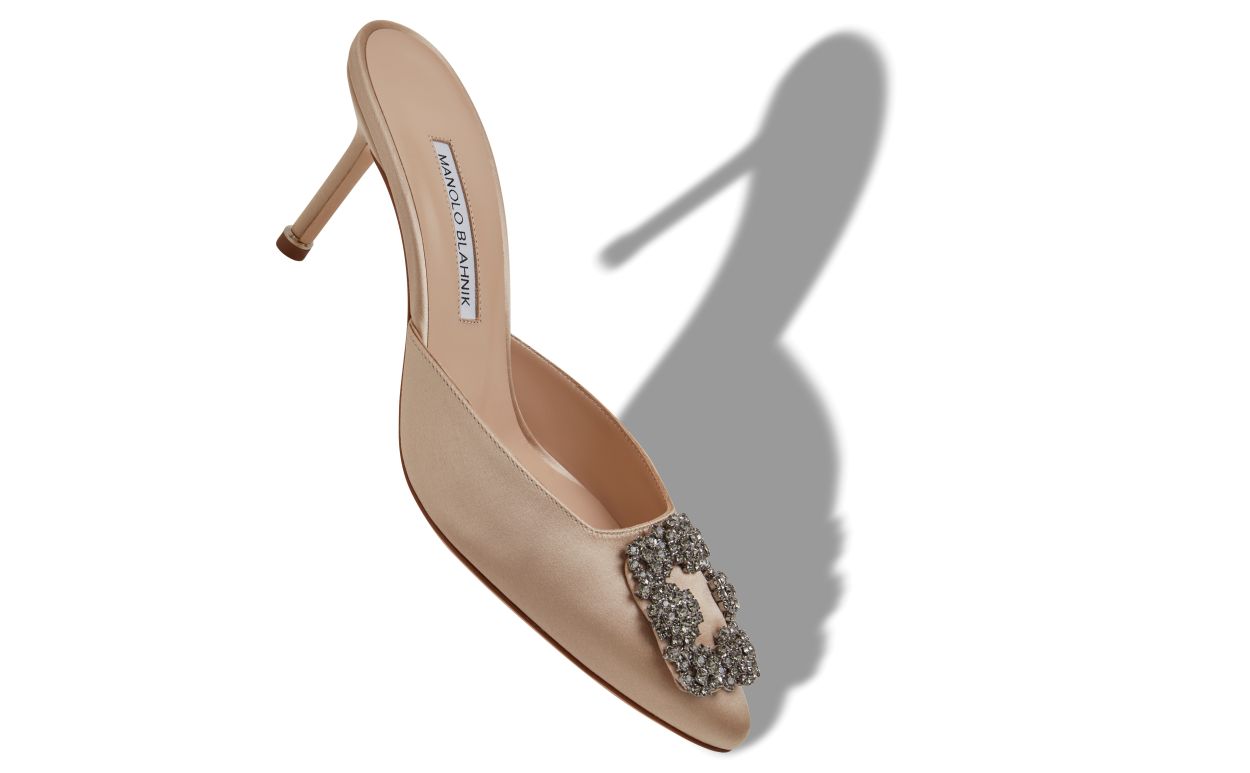 Marcella Crown Neutral Jewel Buckle Mules – front three-quarter view showing neutral jewel buckle, crystal buckle, almond…