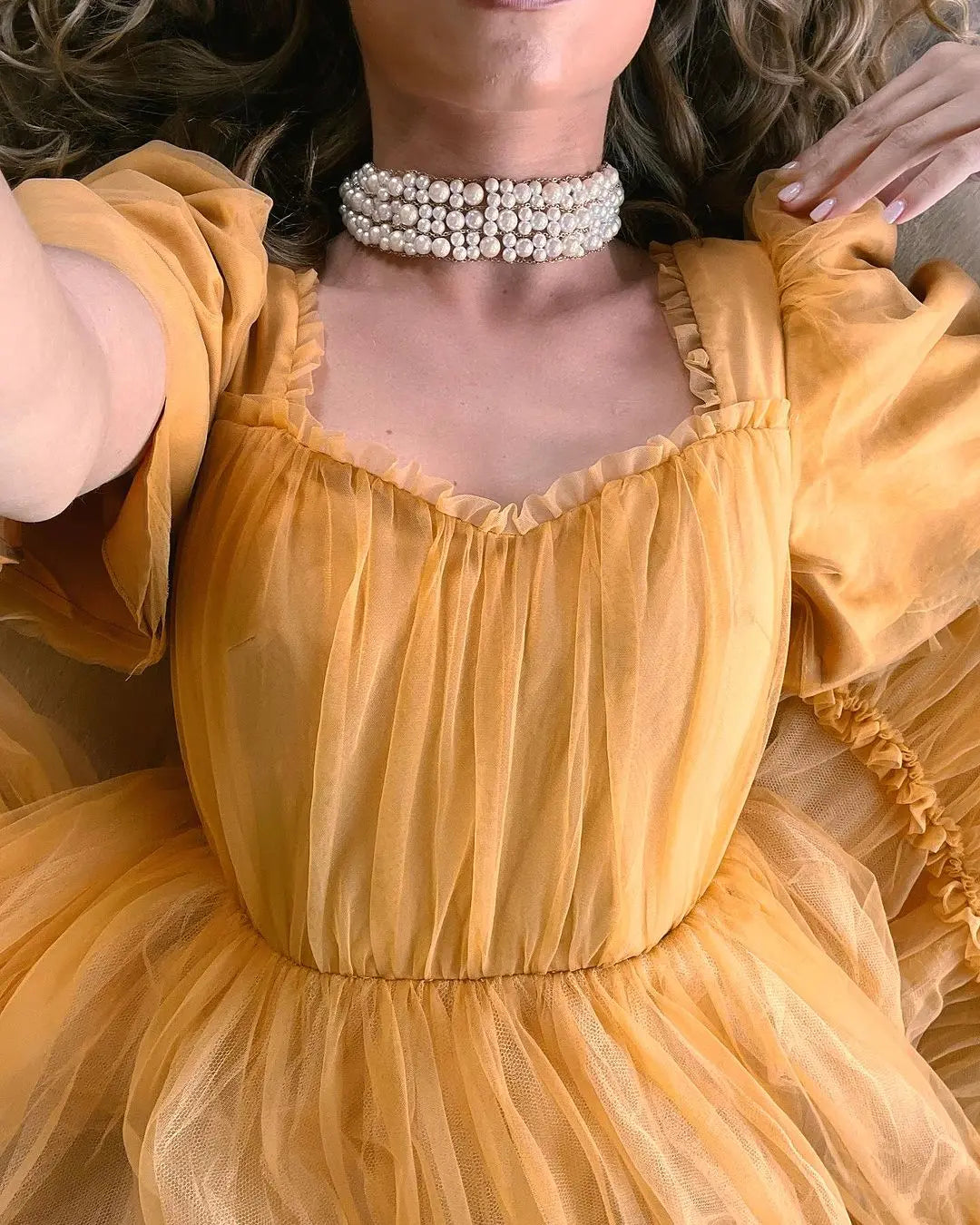 Gold women’s party dress detail