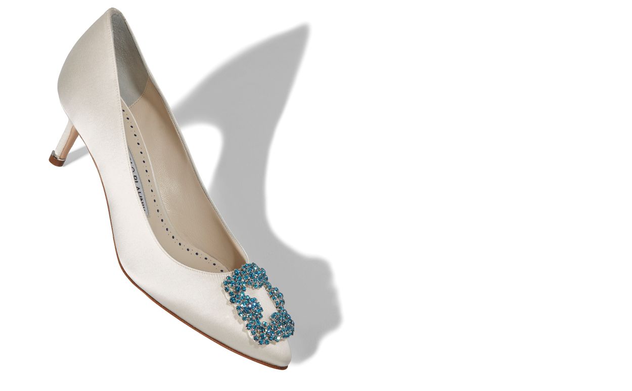 Evangeline Belle White Jewel Buckle Pumps – front three-quarter view showing white jewel buckle, crystal buckle, almond toe…